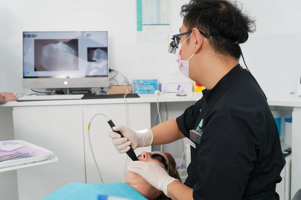 Intraoral digital scan being taken for implant restoration planning