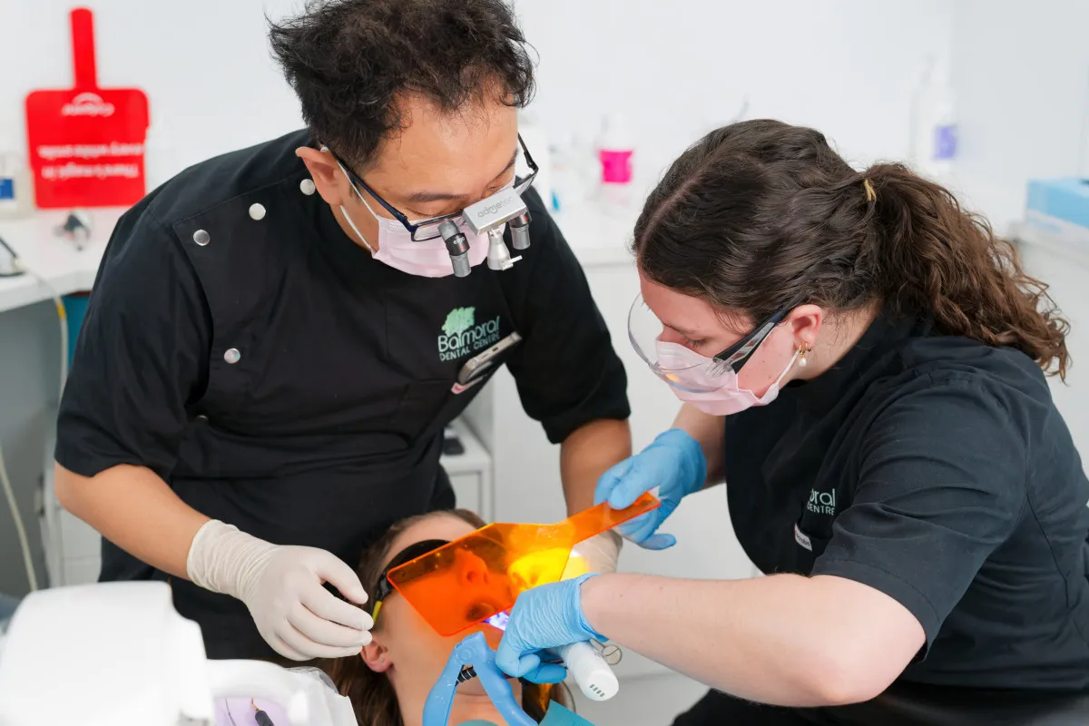 Clinical team providing implant treatment at the Bulimba clinic
