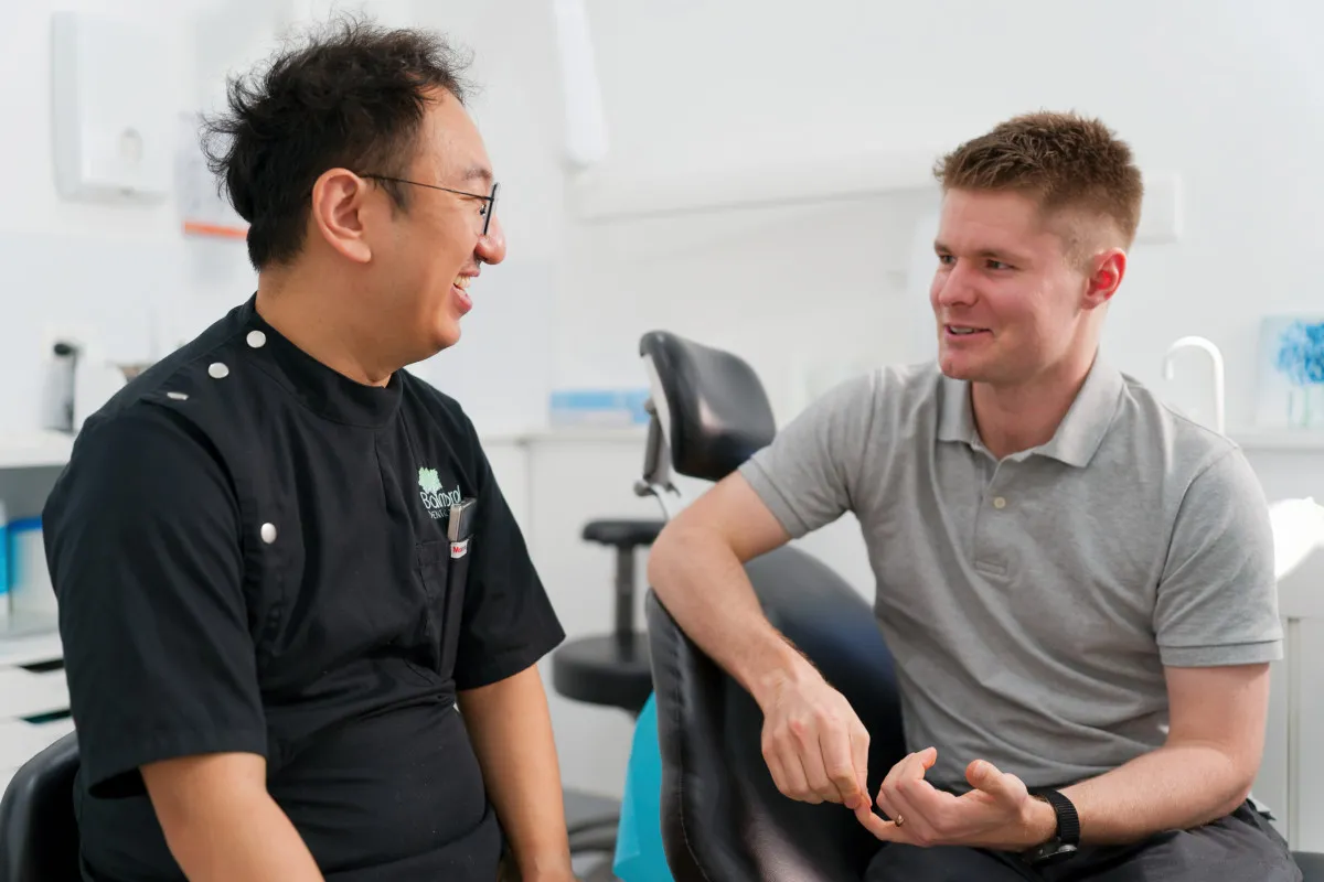 Discussing dental implant payment planning options in Brisbane