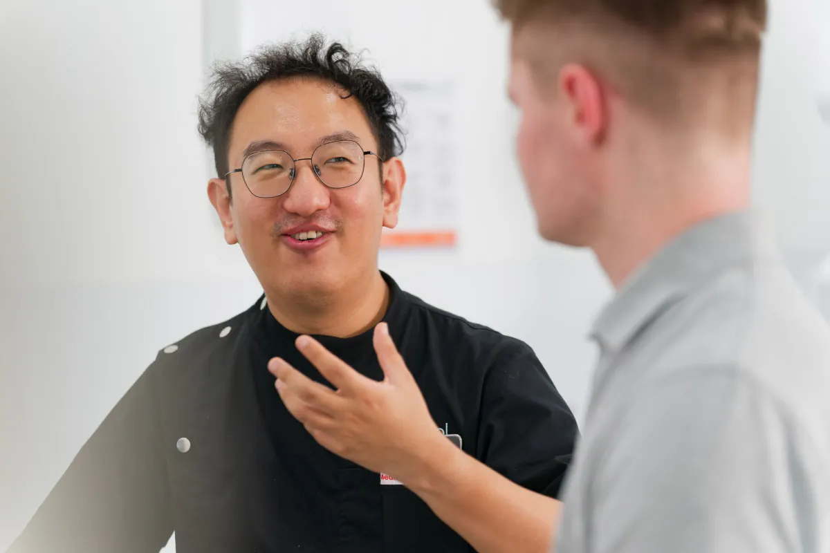 Implant dentist discussing treatment options with a patient in Bulimba