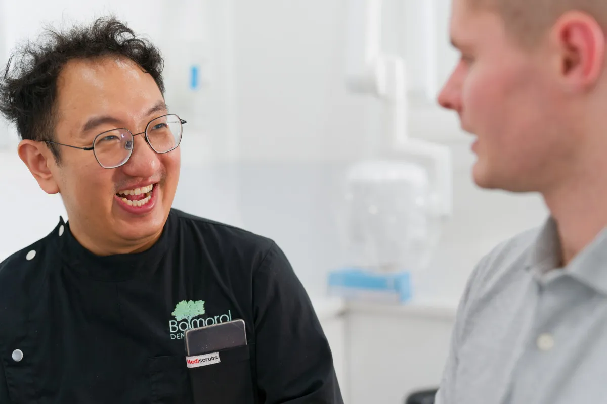 Clinician discussing implant treatment options with a patient