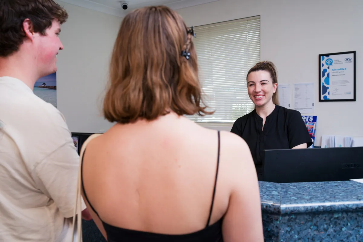 Patients checking in at the Bulimba implant clinic reception